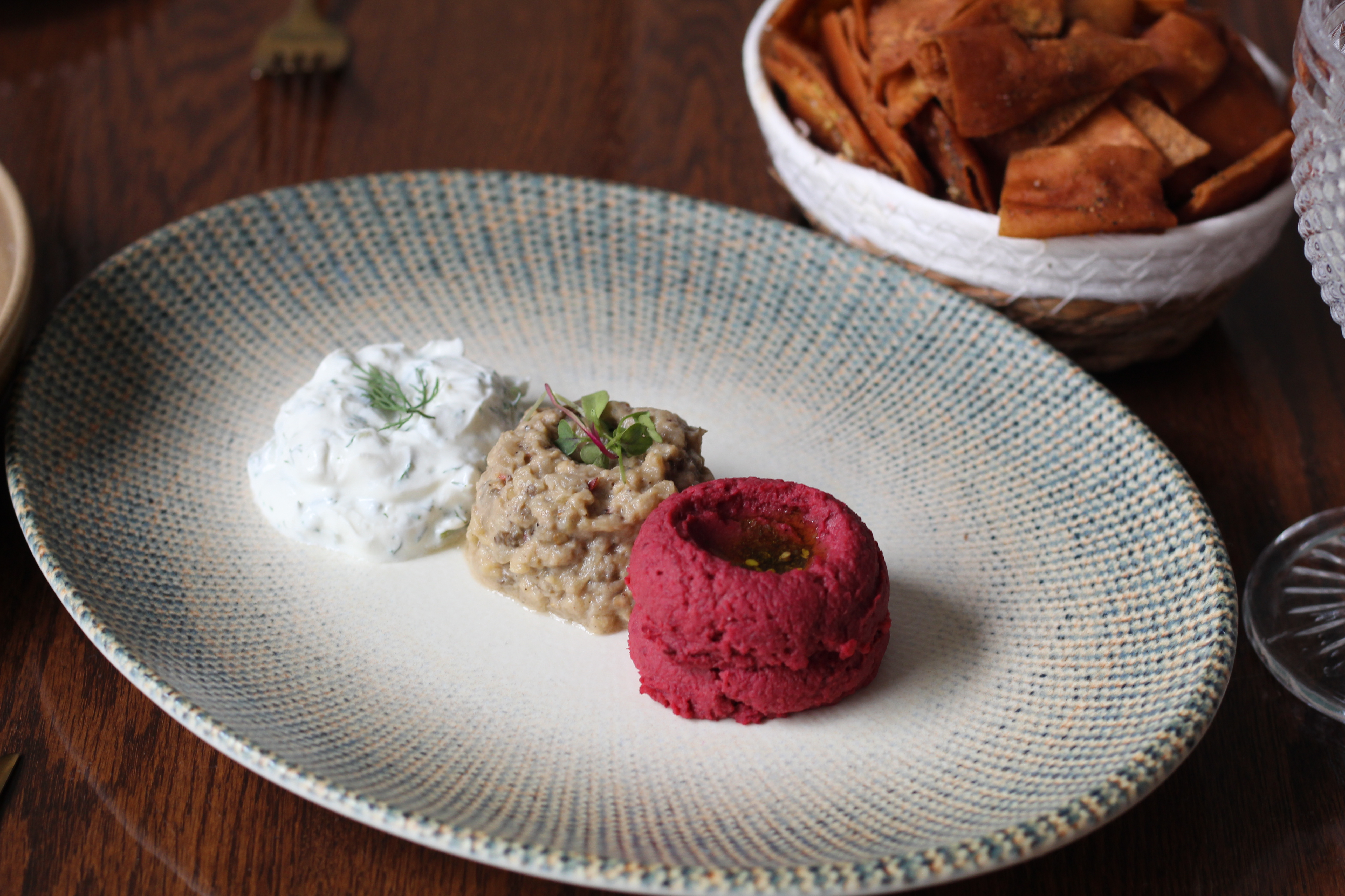 Trio of dips with zaatar pita chips